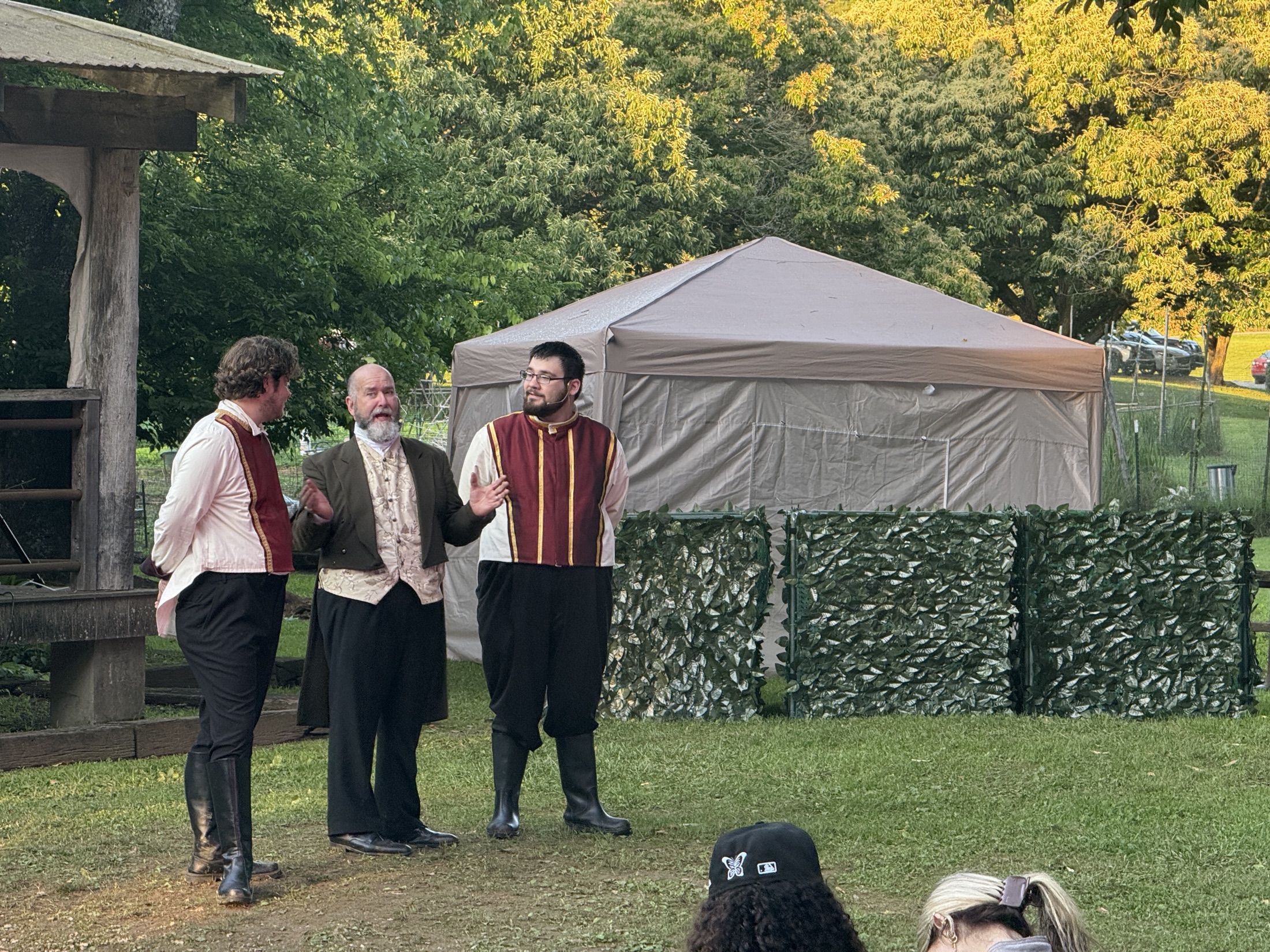 Three performers share a comic moment onstage