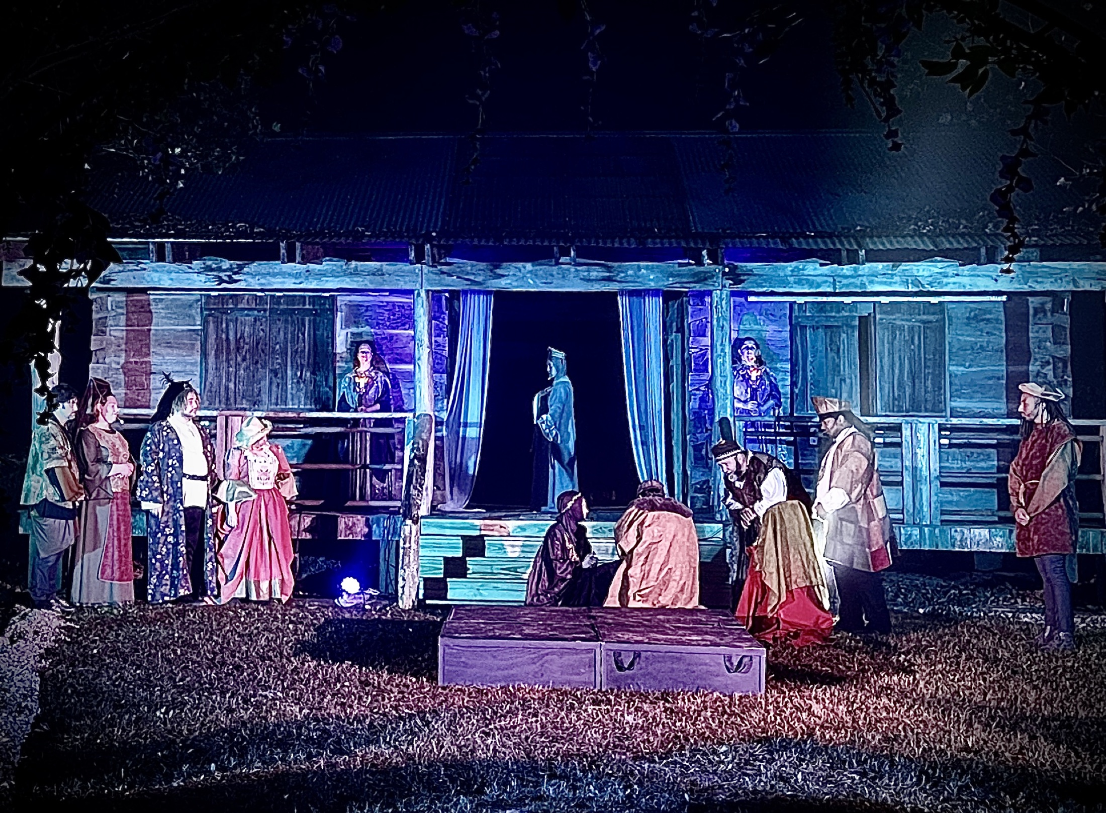 The full company gathers after an outdoor performance